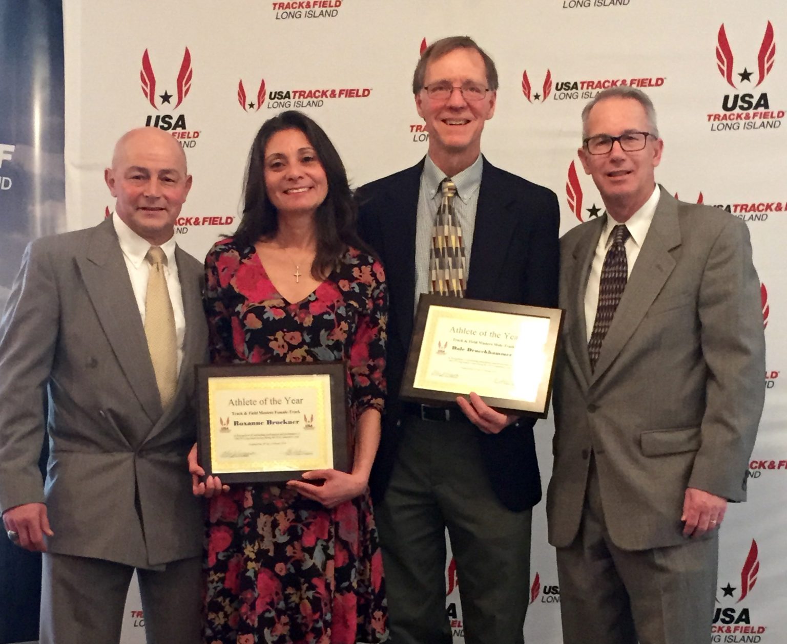 Roxanne Brockner and Dale Drueckhammer (center) at the USATFLI Award Ceremony at Hofstra University on February 10, with USATFLI President Alex Cuozo (left) and USATFLI Vice President Robert Lemke (right)